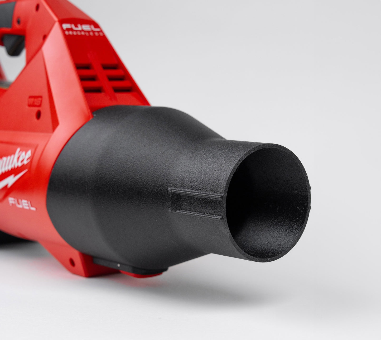 Detailed close-up showing the locking tab on the Arbite ShortFlow nozzle, ensuring a secure fit on the Milwaukee 3017-20 blower.