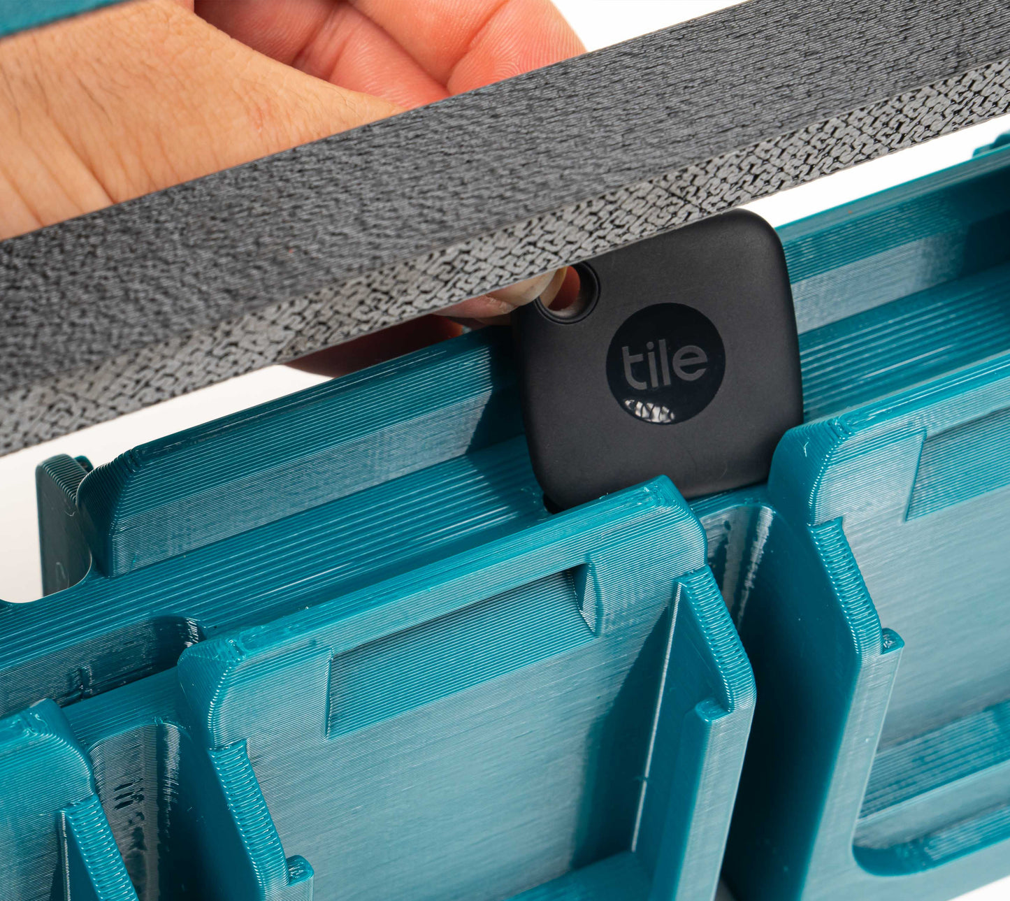 close-up of tracker pocket slot inside Makita Charge Pack handle area