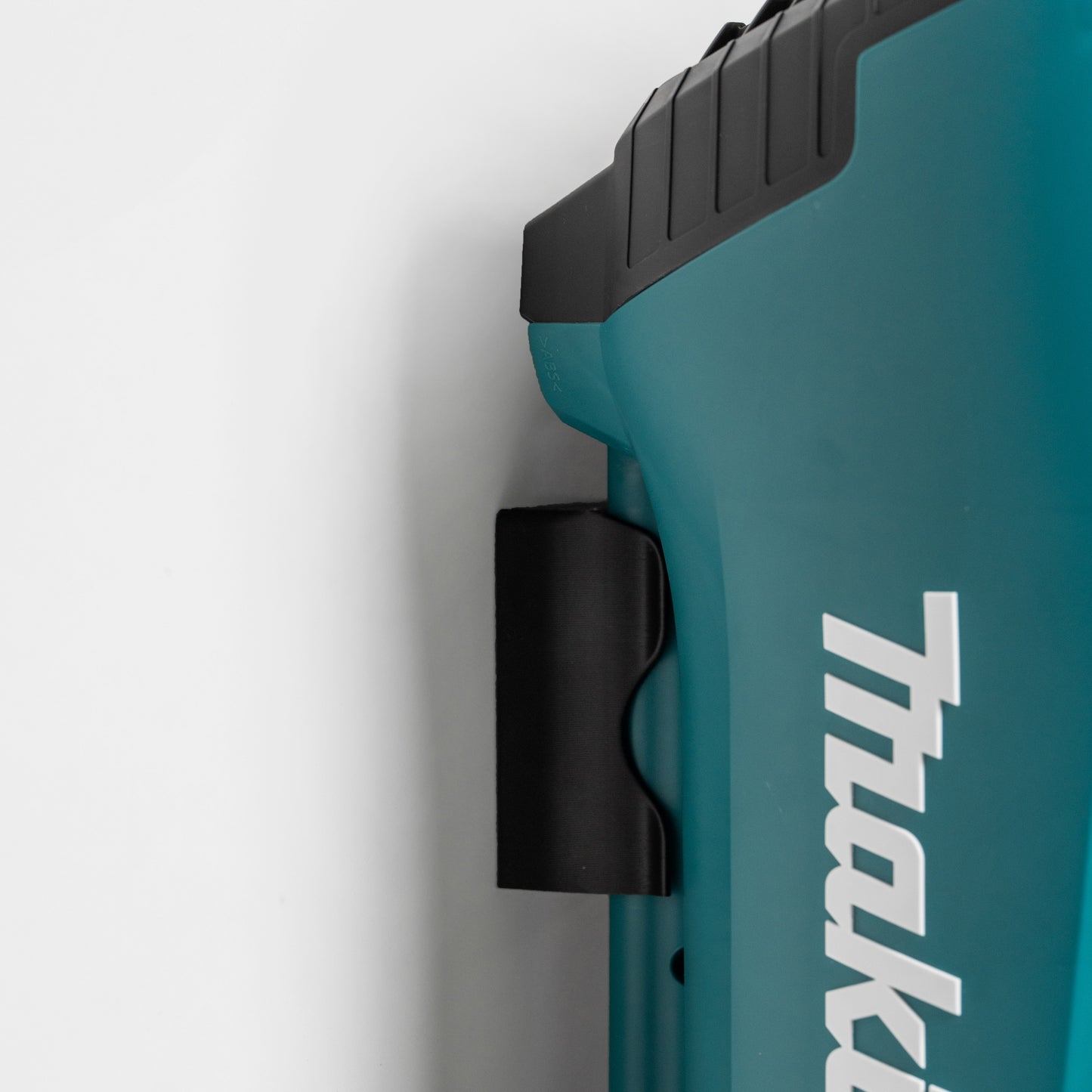 side view of Makita blower in wall mount for vertical storage