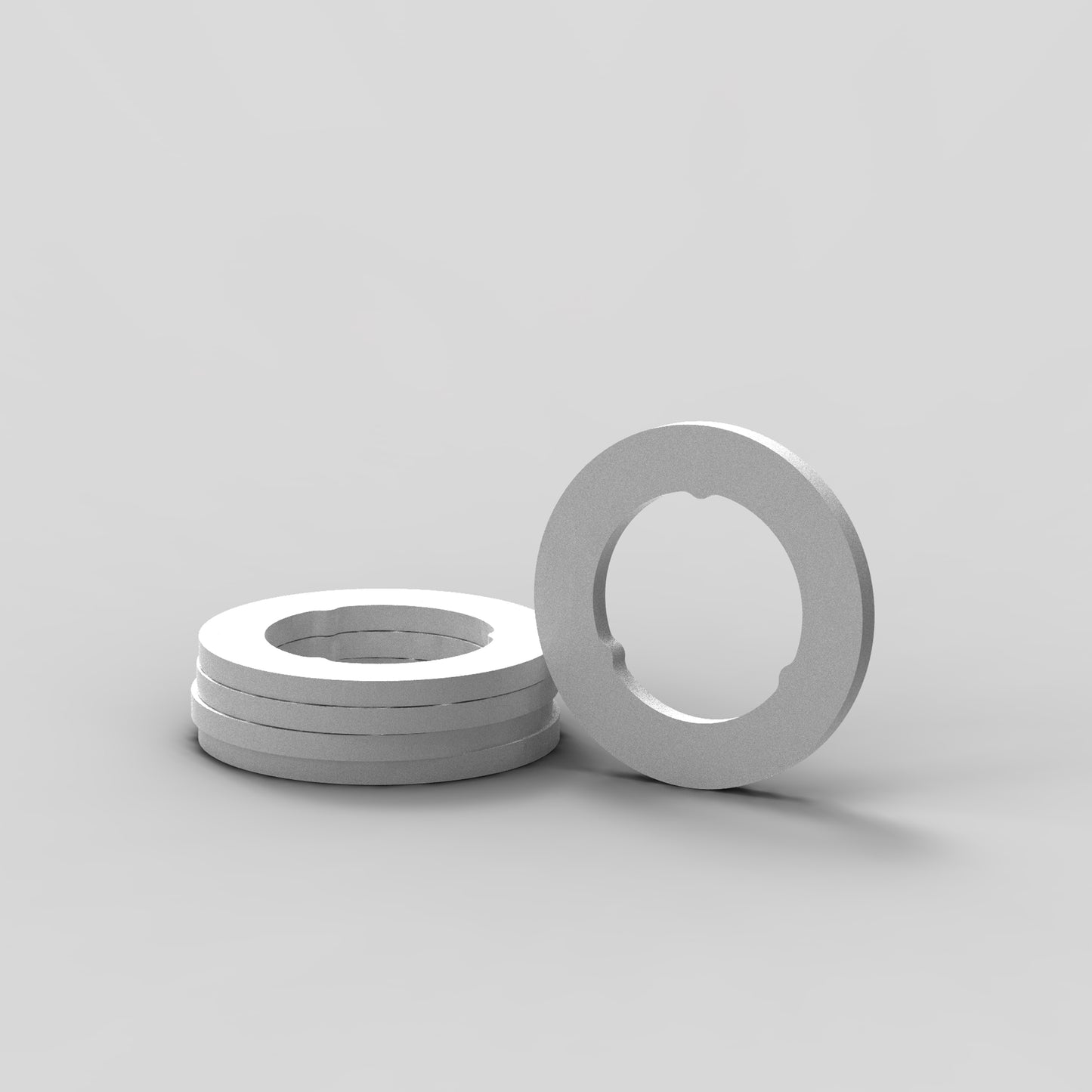 Front view of 5 stacked door hinge washers compatible with GE and Hotpoint