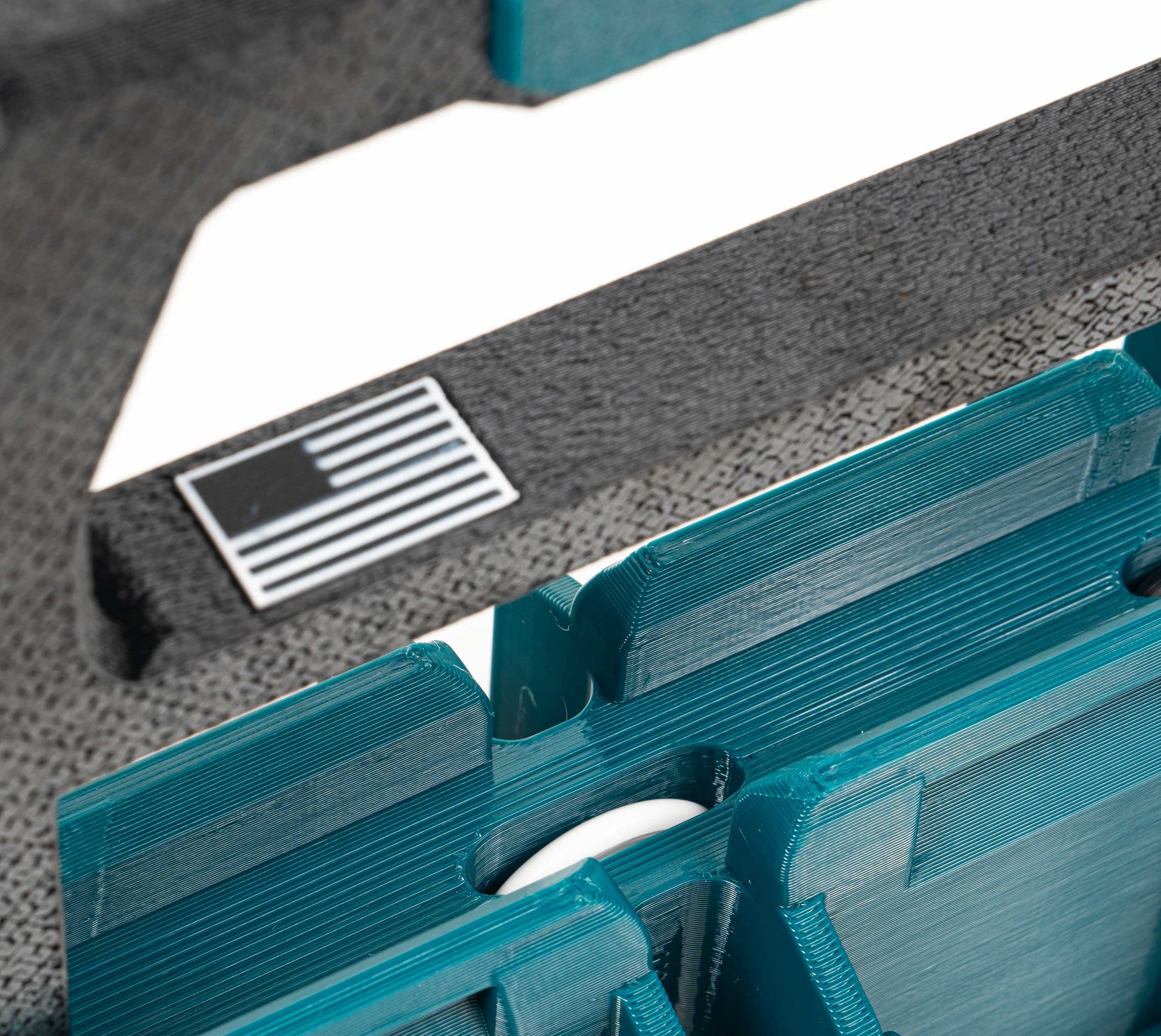 lifting handle upward on Makita Charge Pack to expose hidden AirTag pocket