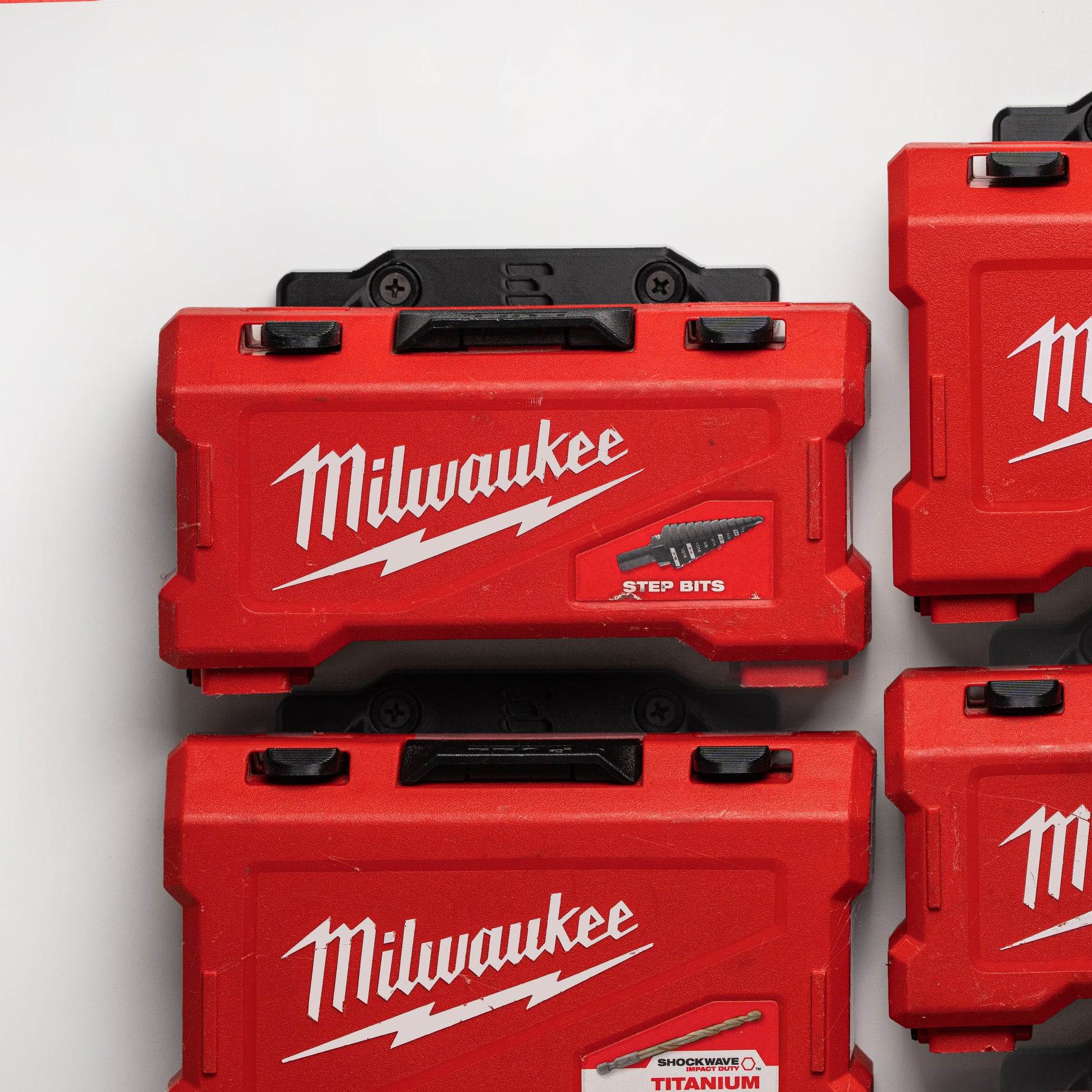 close-up showing snug clip fit of Milwaukee drill bit box onto wall bracket